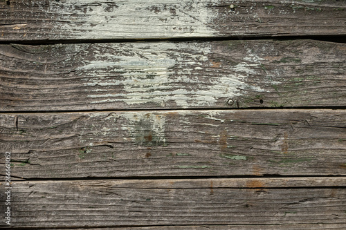 Closeup texture of old wood with cracks pattern, abstract background