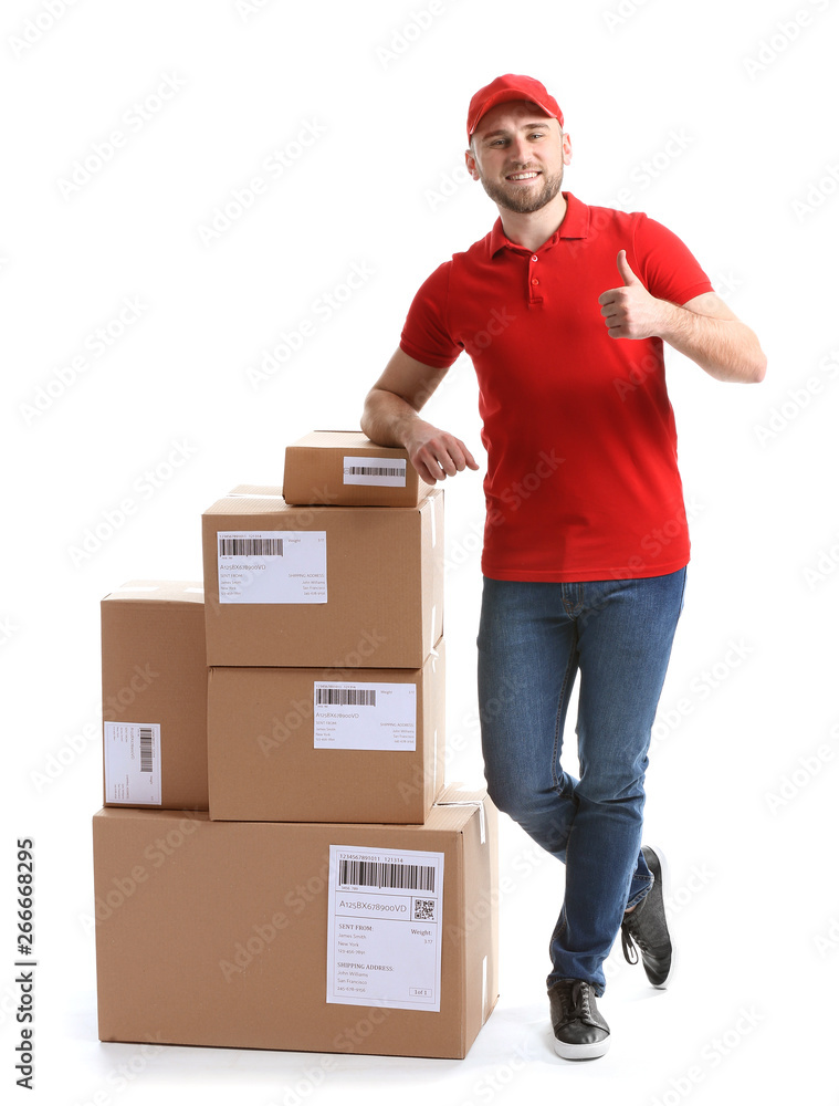 Handsome delivery man with boxes on white background Handsome delivery man with boxes on white background