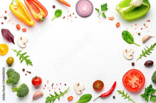 Ingredients and spices for homemade pizza on white wooden background. Top view with copy space.