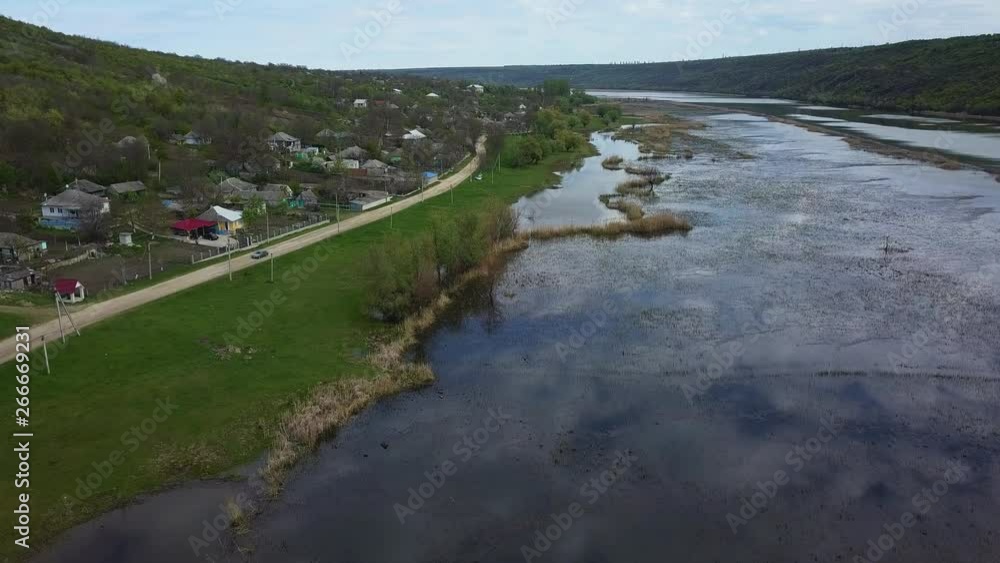 Arial view over the river and small village. Dniester river of Moldova republic. Arial view over the river and small village. Dniester river of Moldova republic.