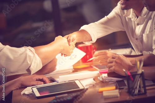 Business people shaking hands, finishing up a meeting Handshake Business concept.vintage color