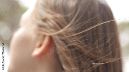 Macro photography of hair and walks in the Park. Hair flying in the wind and the sun.