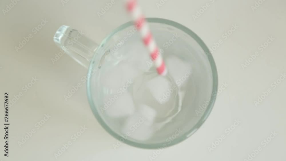 Adding carbonated water and ice. Step-by-step preparation of cocktails in glass. Adding carbonated water and ice. Step-by-step preparation of cocktails in glass.