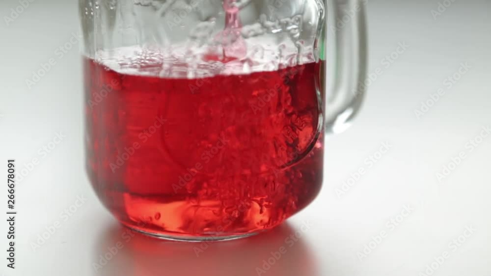 Adding berries and ice to carbonated water. Step by step preparation of cocktails with lemon and orange. Adding berries and ice to carbonated water. Step by step preparation of cocktails with lemon and orange.
