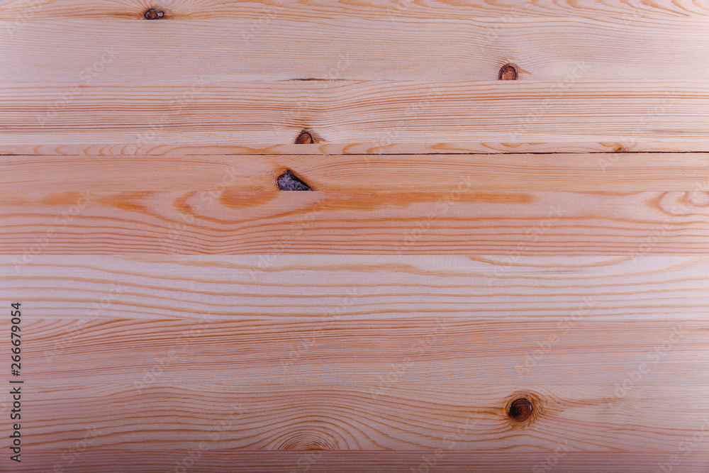 Fototapeta premium wooden board with a beautiful texture and knots as background