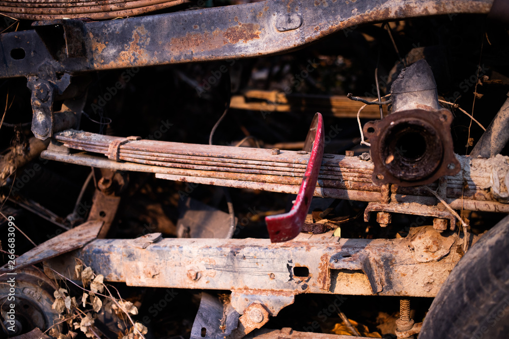 Parts of used cars sitting in junkyard