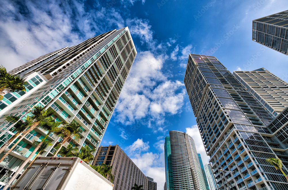 Upward street view of Downtown Miami skyscrapers on a beautiful sunny day, Florida