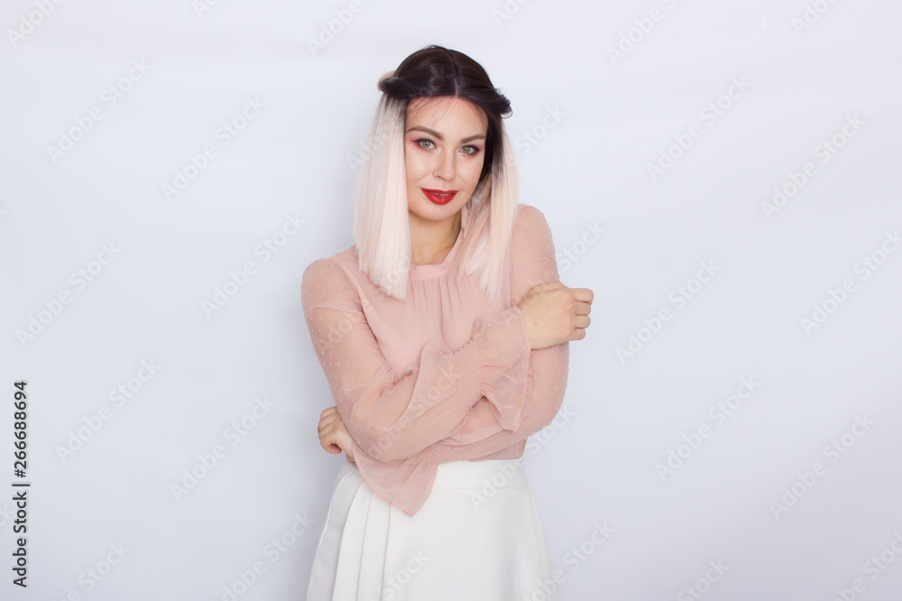 Romantic portrait of blonde woman in light pink blouse Romantic portrait of blonde woman in light pink blouse