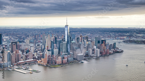 New York City from helicopter point of view. Downtown Manhattan, Jersey City and Hudson River on a cloudy day