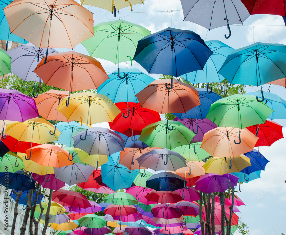 .Colorful umbrella background Beautiful colorful umbrella with beautiful sunshine shining through