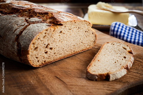 Freshly baked sliced loaf of rye bread in closeup