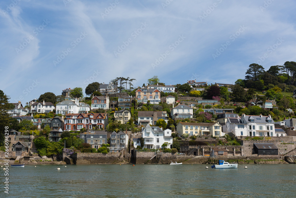Historic English town of Dartmouth Devon with houses on the hillside and River Dart Historic English town of Dartmouth Devon with houses on the hillside and River Dart