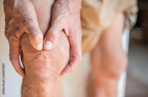 The knee of the elderly with muscle inflammation and bone degene photo