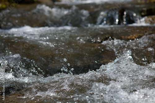 Air bubbles in fast flowing water stream