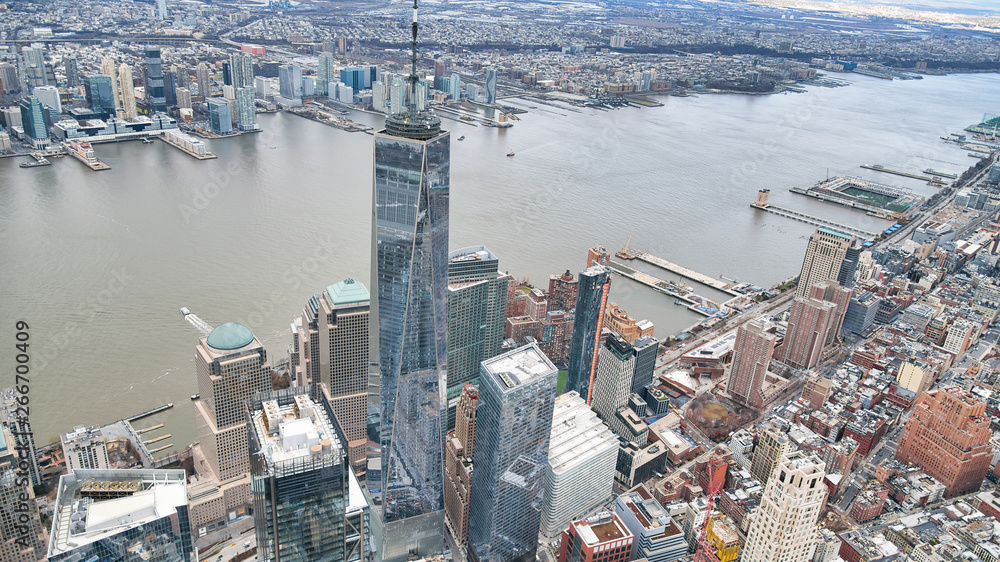 New York City from helicopter point of view. Downtown Manhattan skyscrapers on a cloudy day
