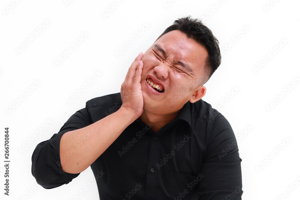 Young man suffering from toothache on white background, closeup Young man suffering from toothache on white background, closeup