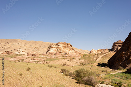 hilly field and rock mountain