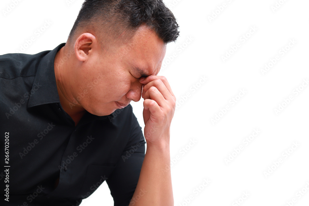 Young man suffering from headache. Healthcare, pain, stress and people concept Young man suffering from headache. Healthcare, pain, stress and people concept