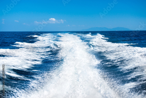 Wake of boat on water surface