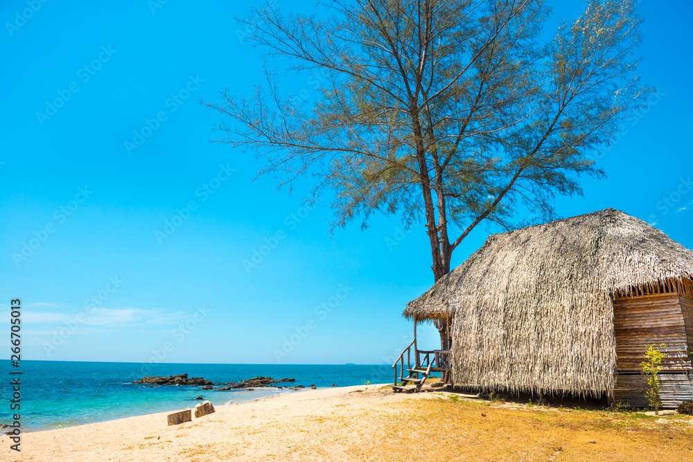 View of sand beach and hut at tropical island View of sand beach and hut at tropical island