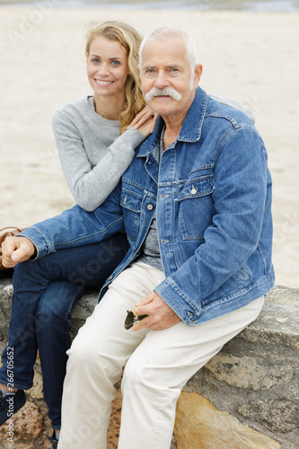 couple embracing by the beach © auremar