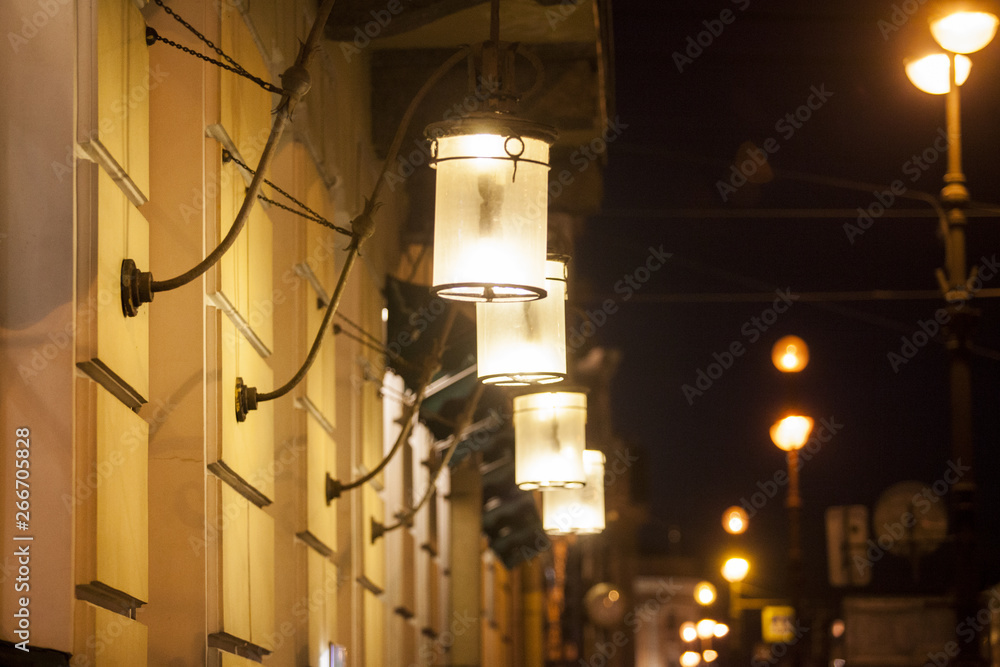 Light of lanterns on a dark street Light of lanterns on a dark street