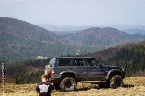 Mountain view and car. Offroad on Jeep in the Carpathian Mountains