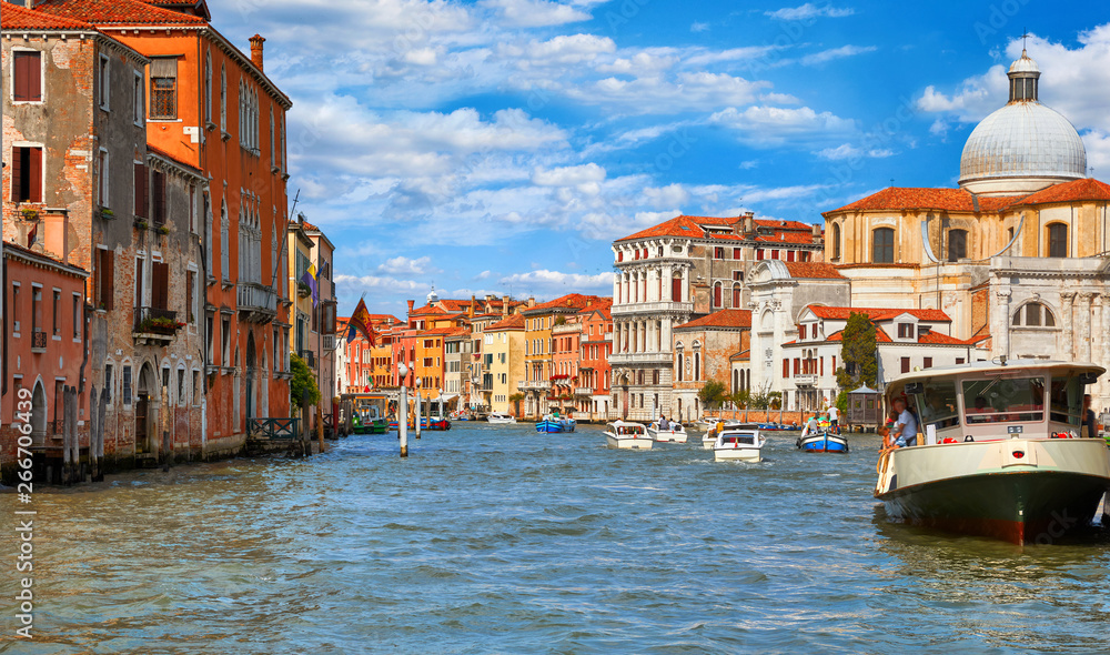 Grand canal panoramic view Venice Italy historical architecture with blue sky white cloud picturesque landscape.
