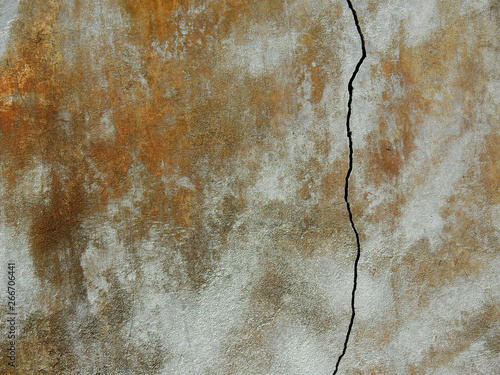 large crack on grunge wall texture background