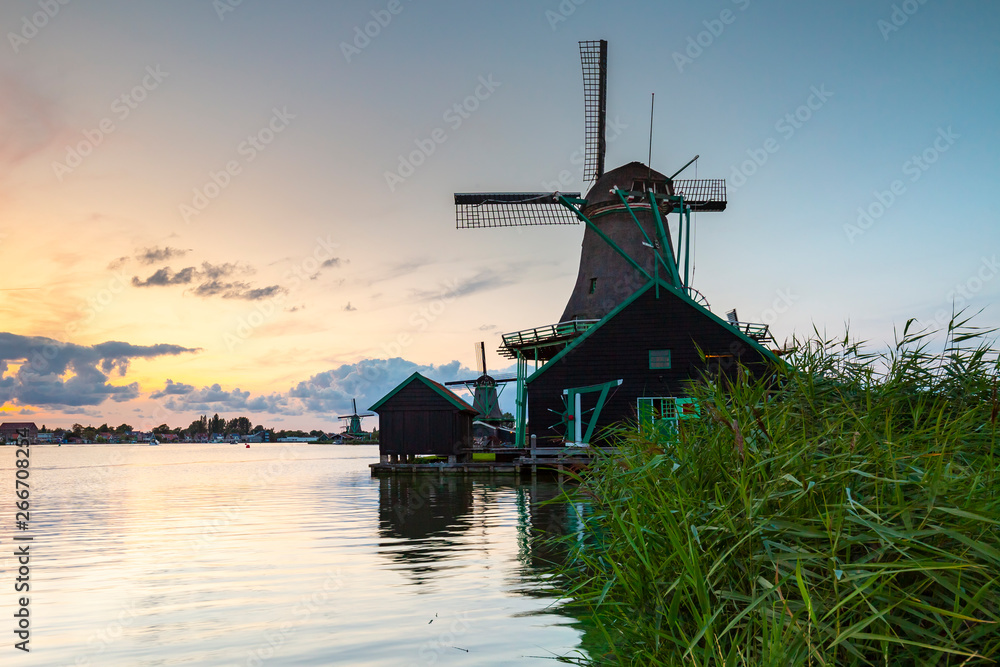 Traditional Dutch windmills at dusk, Zaanse Schans, Amsterdam - obrazy, fototapety, plakaty 