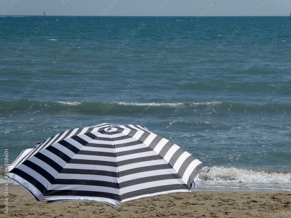 Stripped umbrella at the beach Stripped umbrella at the beach
