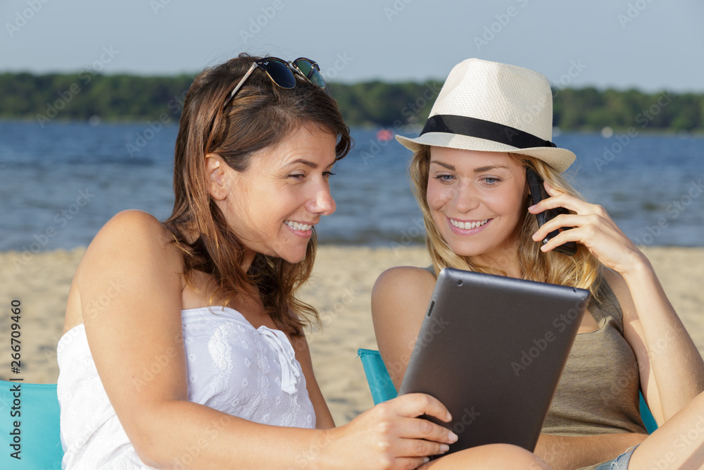 2 women connected on the beach