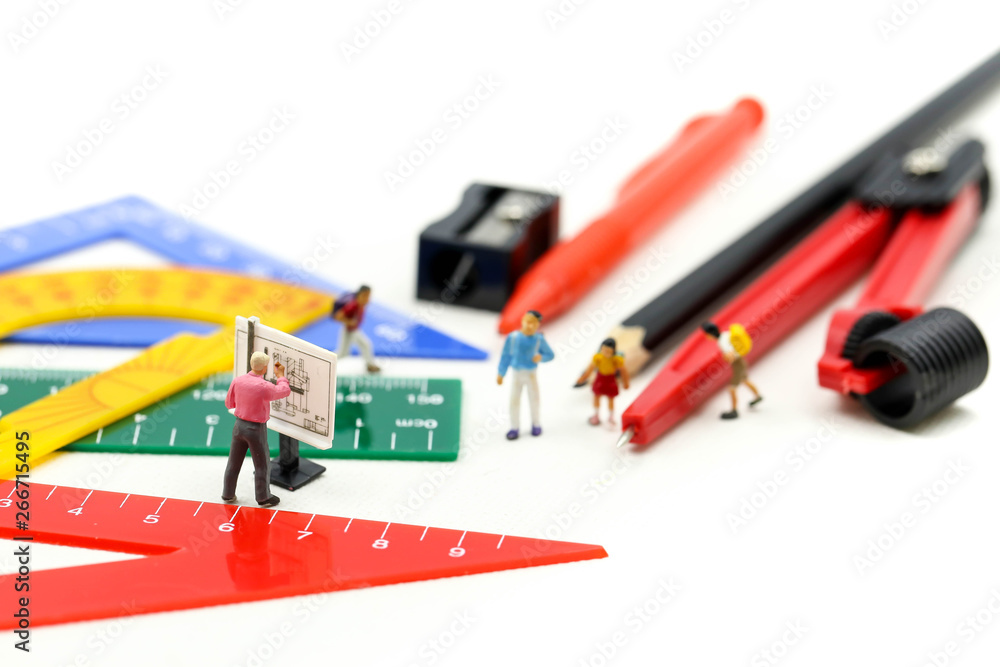 Miniature people : teacher and student with Group of stationery tools Educational tools supplies back to school concept. Miniature people : teacher and student with Group of stationery tools Educational tools supplies back to school concept.