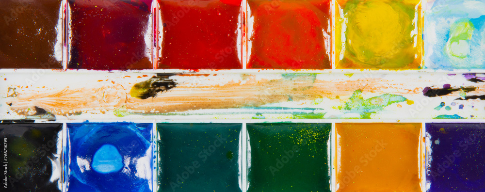 A set of children's paints in rectangular forms close-up