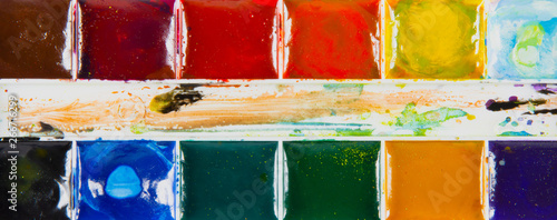 Obraz na płótnie A set of children's paints in rectangular forms close-up w salonie