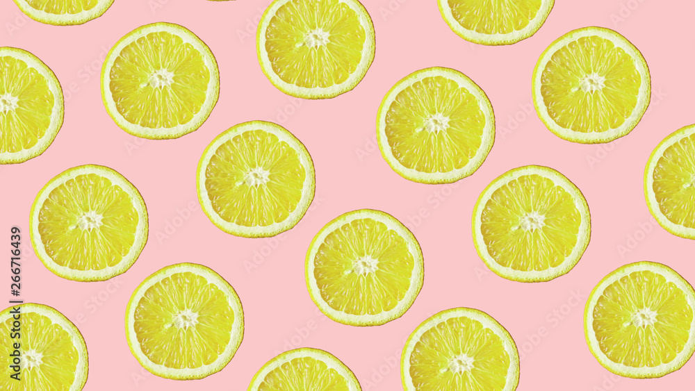 Top view of colorful fruit pattern of fresh lemon on modern pink background