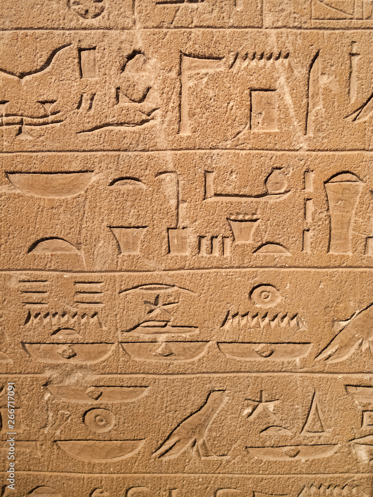 Ancient Egypt tomb hieroglyphs stone wall background