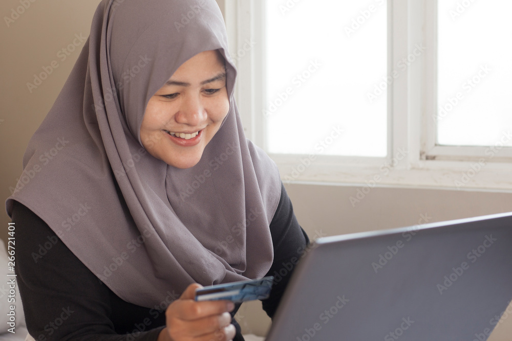 Muslim Woman Making Online Purchase Muslim Woman Making Online Purchase