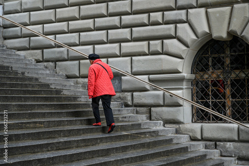 Frau auf der Rathausstiege, Luzern, Schweiz photo