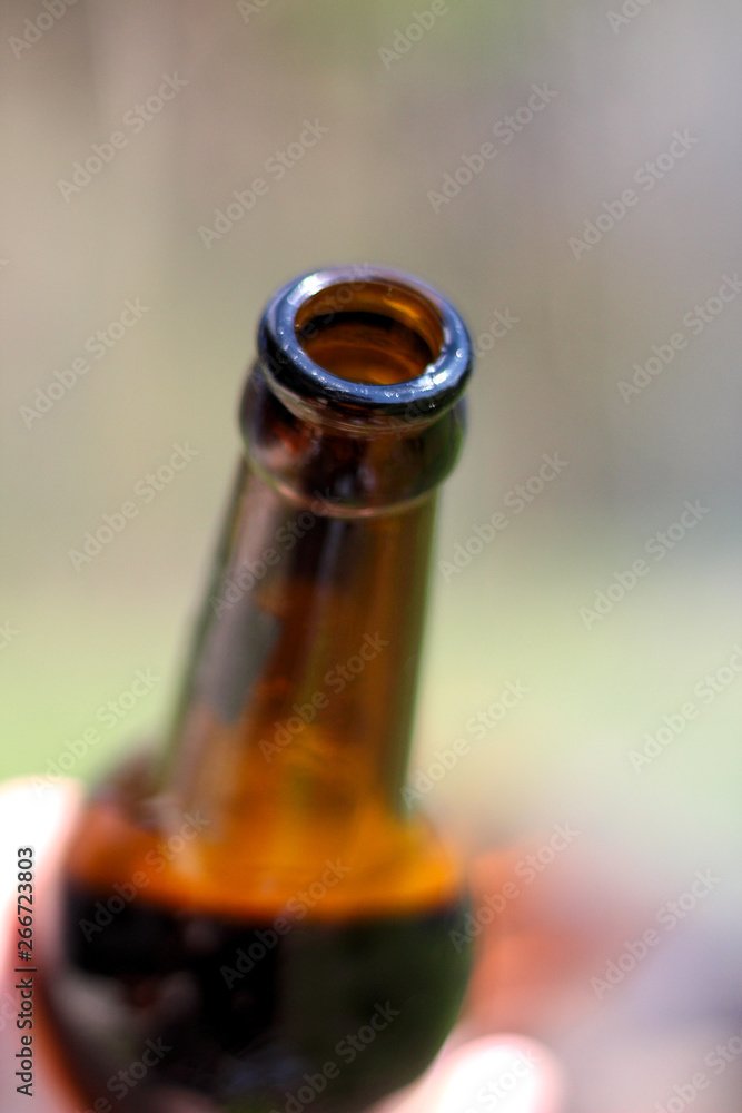 the neck of a bottle of beer