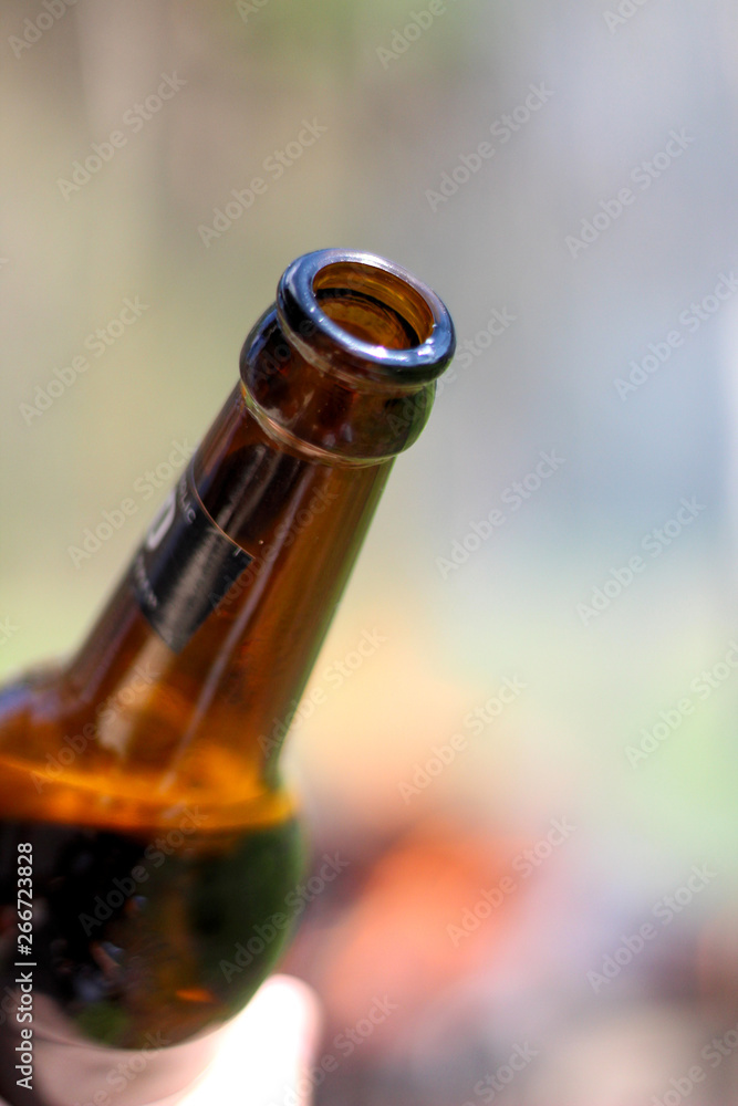 the neck of a bottle of beer