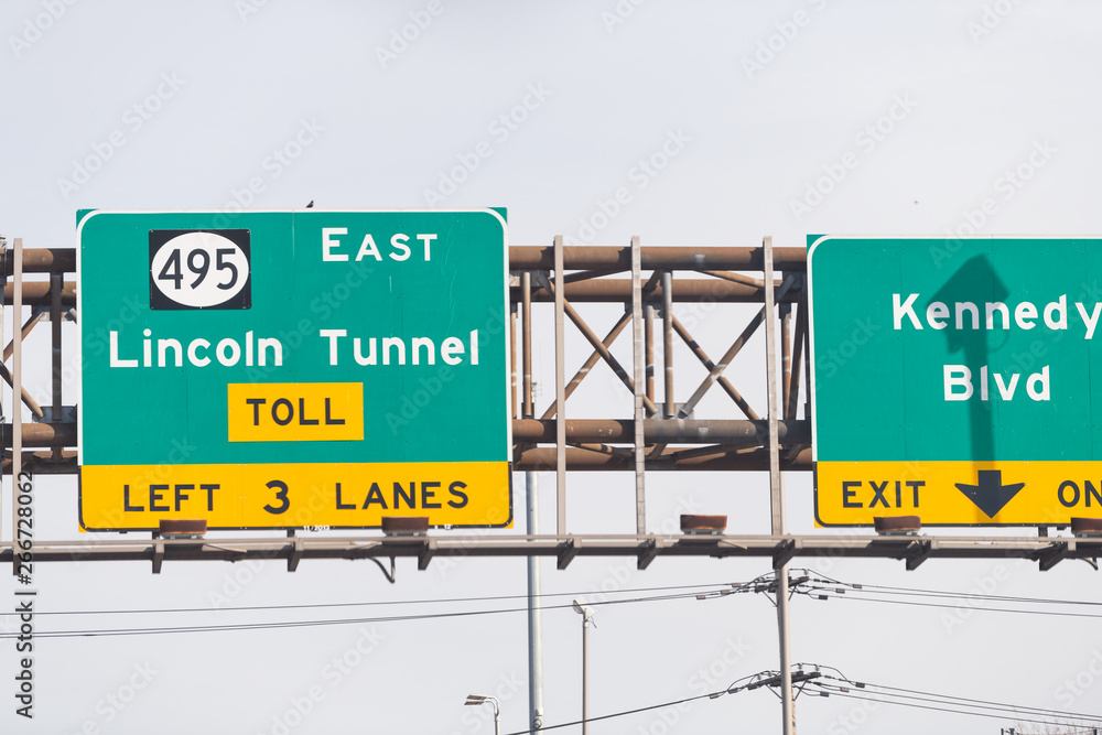 Weehawken, USA Exit sign closeup in New Jersey for Lincoln Tunnel toll on 495 east and Kennedy Boulevard