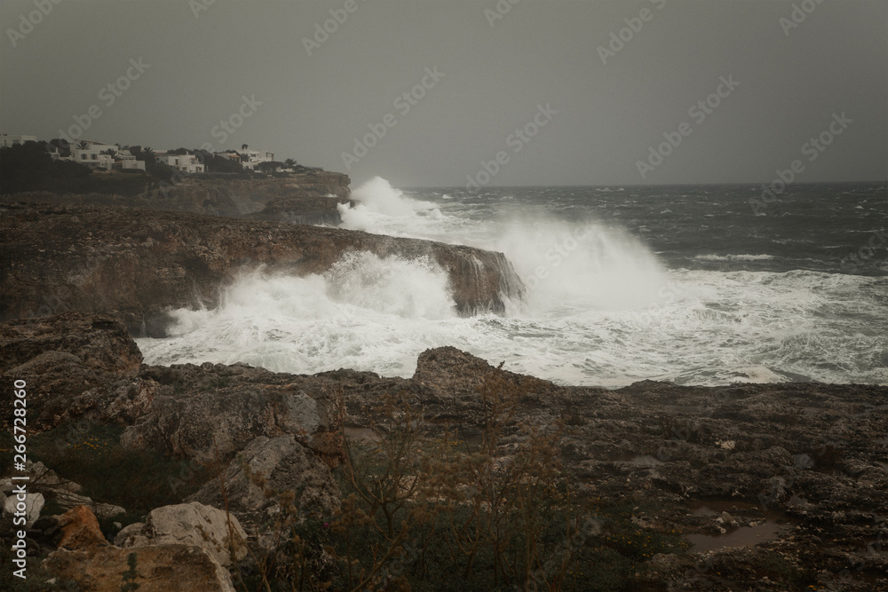 Waves crashing on rocks