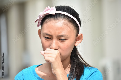 A Coughing Filipina Girl