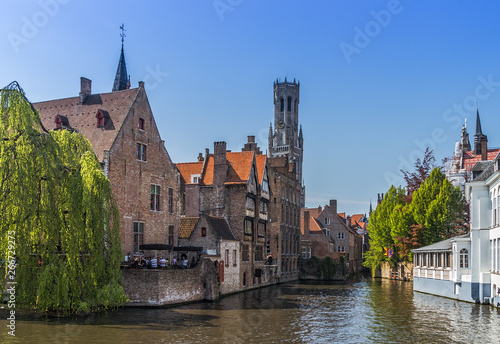 Beautiful canal and traditional houses in the old town of Bruges photo