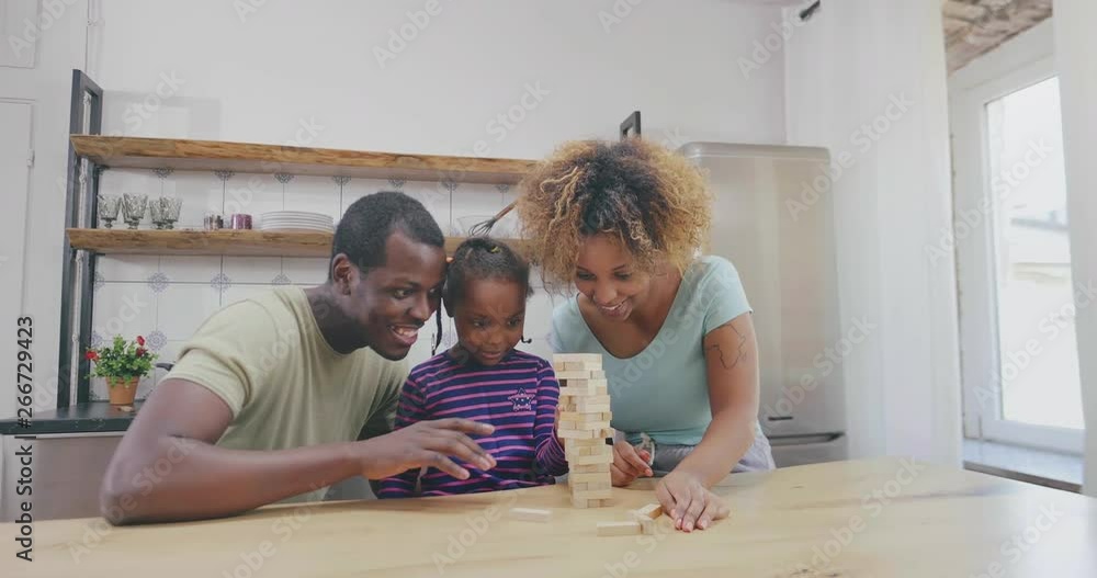 Family playing jenga