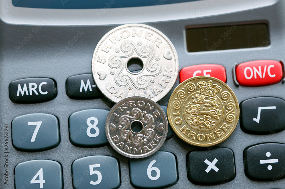 Mixed Danish Coins On A Calculator Accounting Concept The Krone Is mixed-danish-coins-on-a-calculator-accounting-concept-the-krone-is