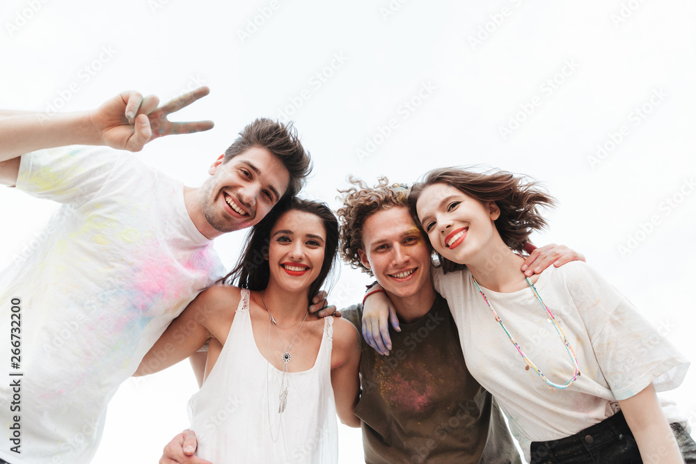 Group of a cheerful young friends having fun at the beach Group of a cheerful young friends having fun at the beach