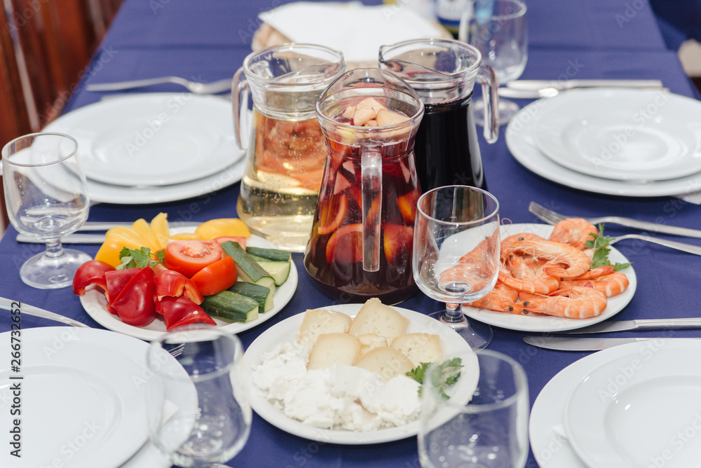 Portuguese dinner cheese, shrimps and sangria fruit wine cocktail Portuguese dinner cheese, shrimps and sangria fruit wine cocktail