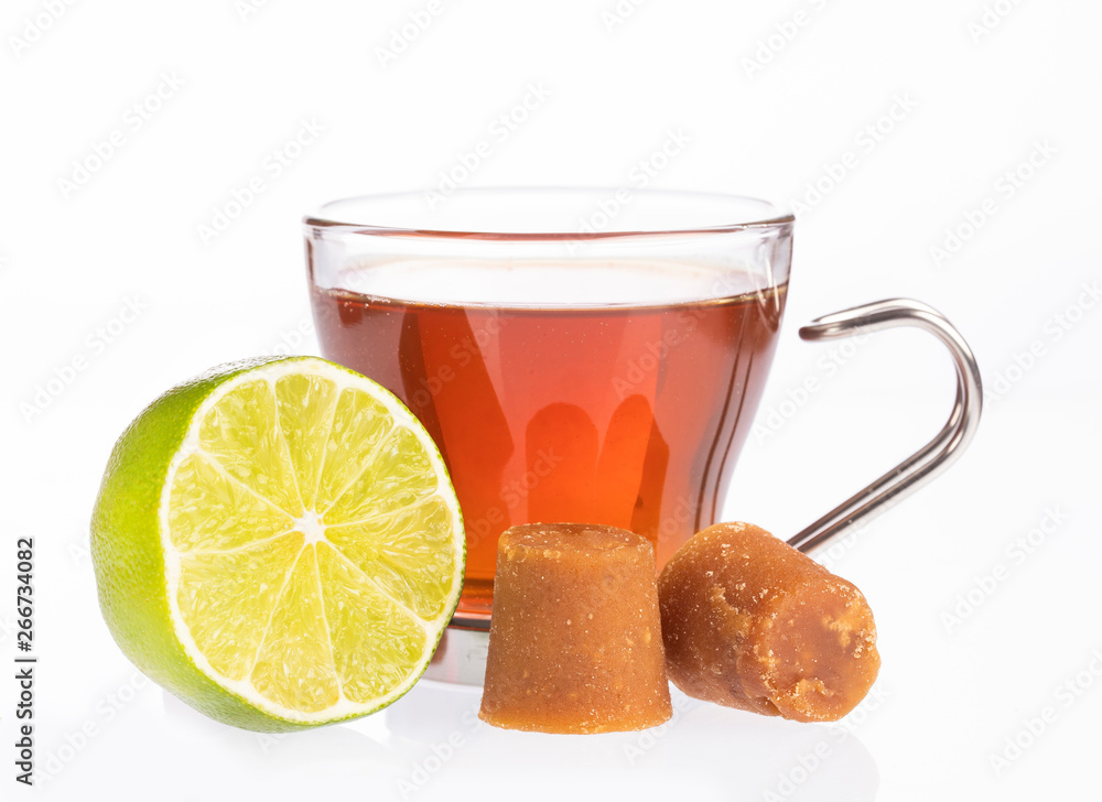 Fresh homemade Aguapanela, Agua de Panela or Aguadulce, a popular Latin American sweet drink made of panela unrefined whole cane sugar boiled in water, served warm or cold with lime. Fresh homemade Aguapanela, Agua de Panela or Aguadulce, a popular Latin American sweet drink made of panela unrefined whole cane sugar boiled in water, served warm or cold with lime.